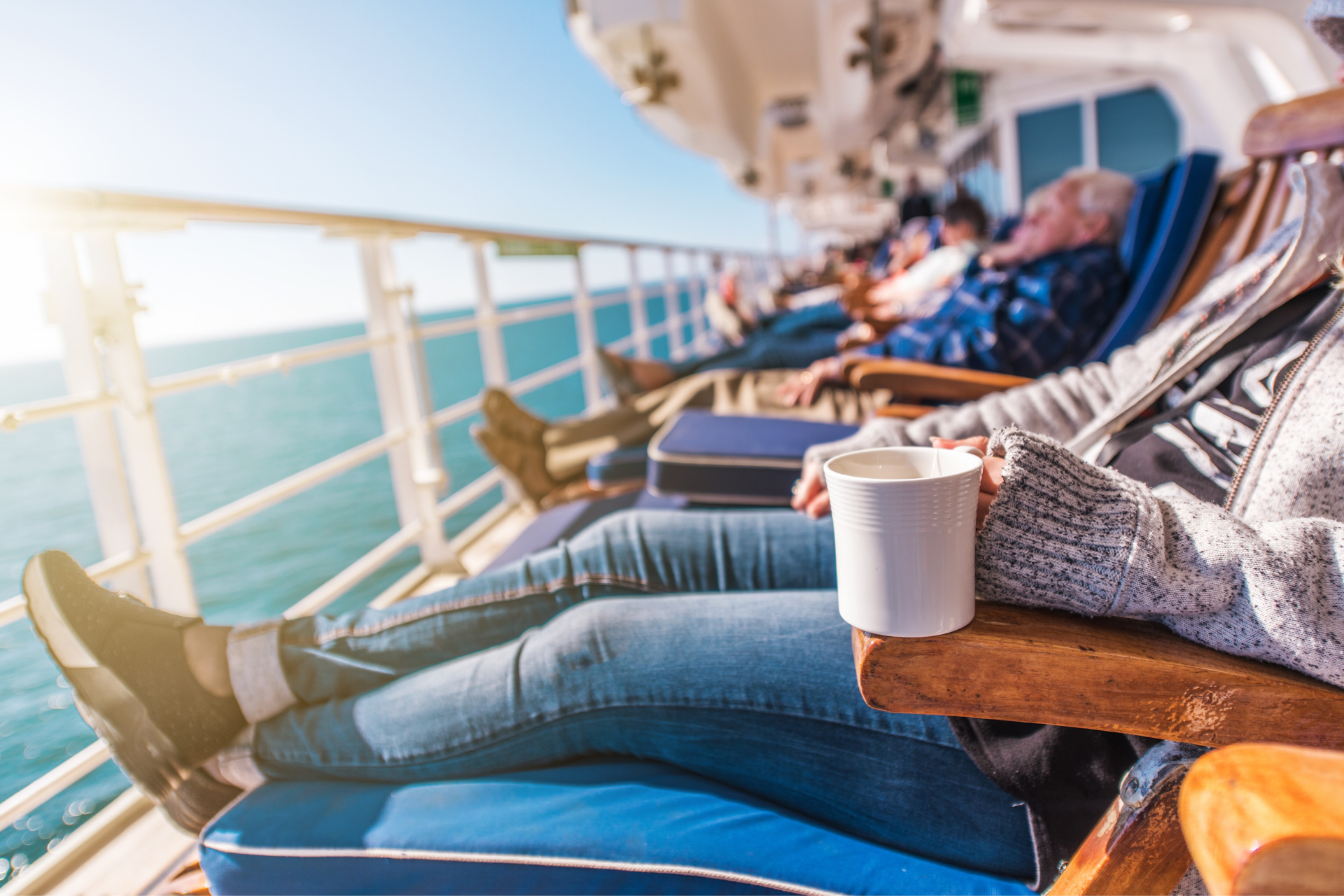 people relaxing on cruise ship deck