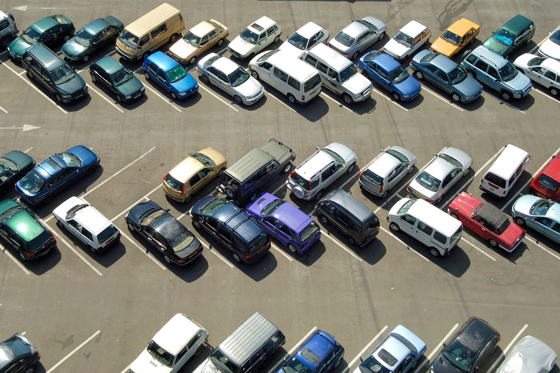 parking lot with cars in spaces